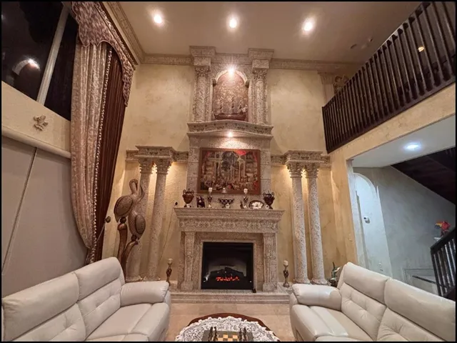 a living room with furniture and a fireplace