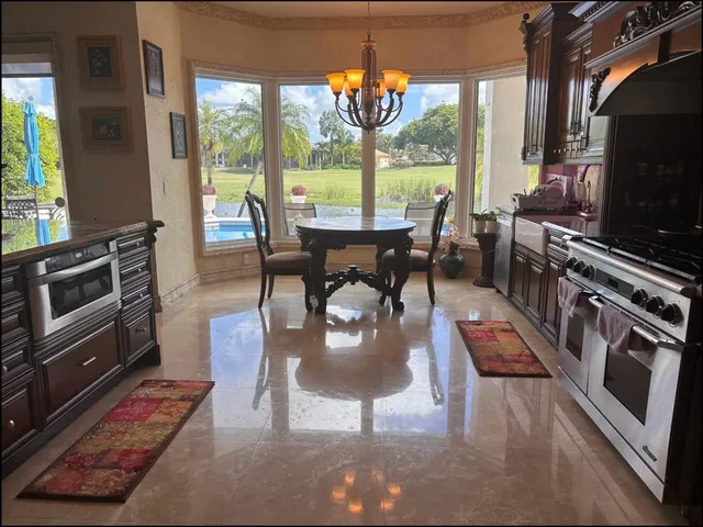 a stove sitting inside of a kitchen with granite countertop