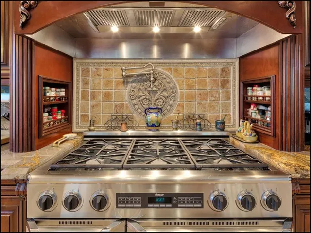 a stove top oven sitting inside of a kitchen