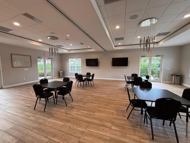 a view of a livingroom with furniture and a fireplace