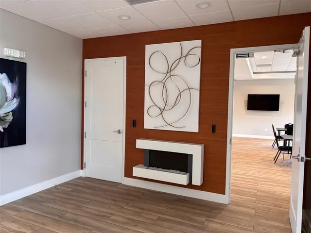 a bathroom with a sink vanity mirror and toilet