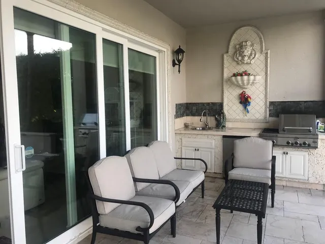 a view of a swimming pool with a patio