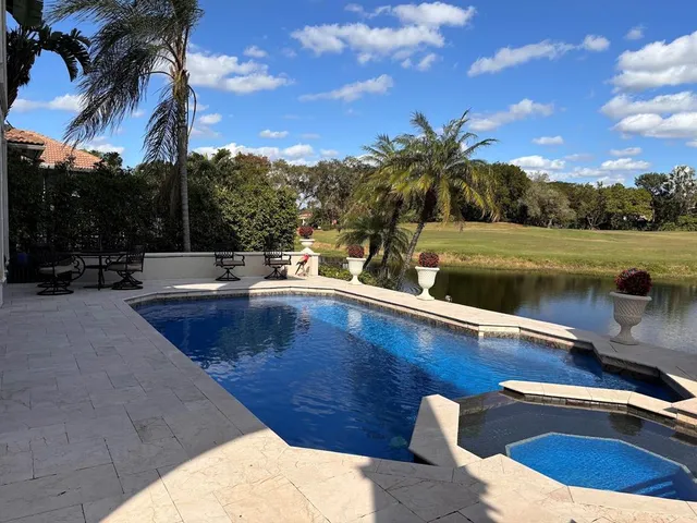 a view of a chairs and table in the patio