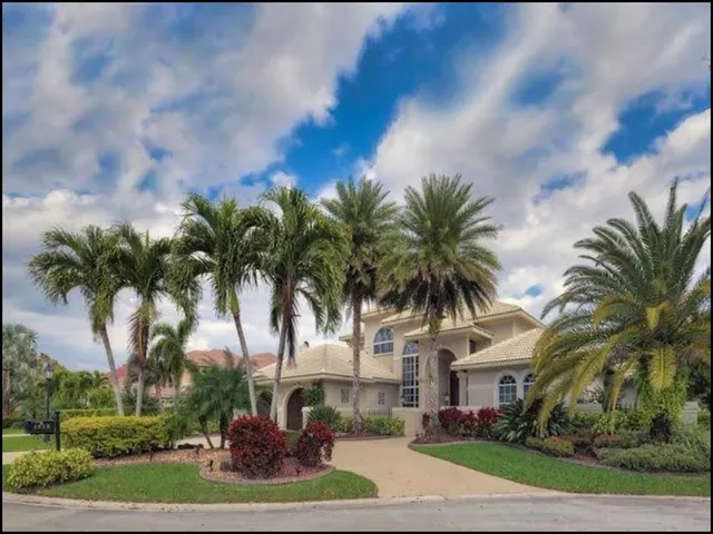a view of a palm trees in front of a house
