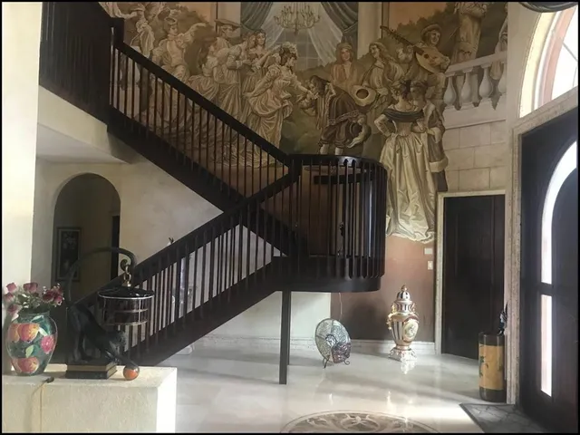 a dining room with furniture and window