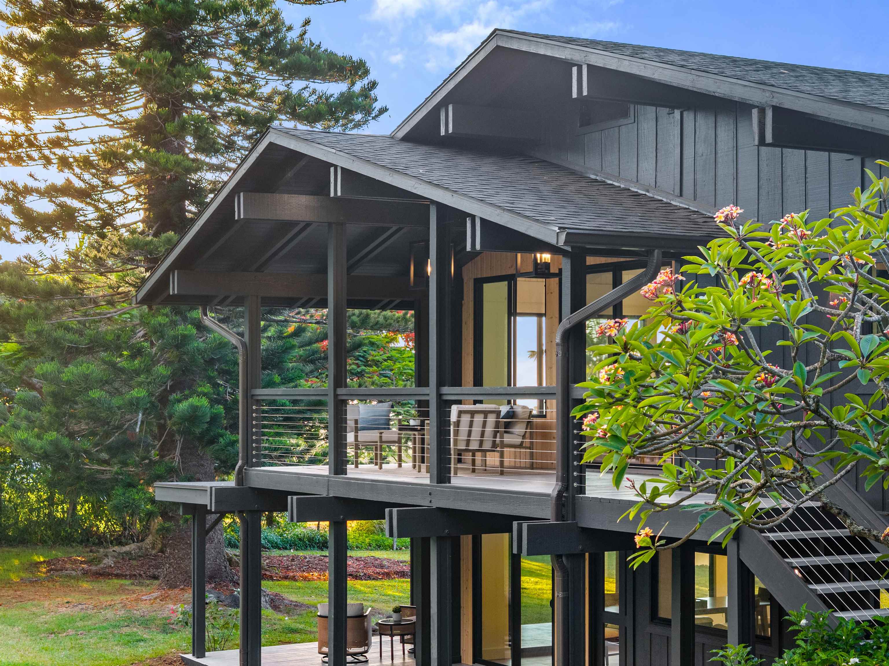 a view of a wooden house with a yard