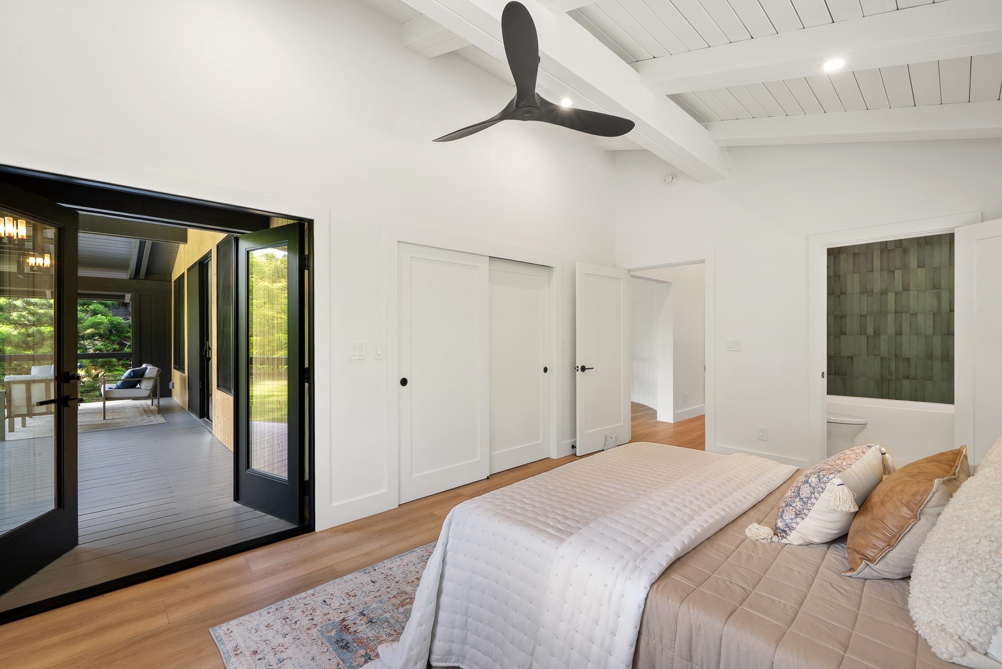 965 Hog Back Road Haiku, HI 96708 - Photo 15 of 35 a bedroom with a bed and a large window