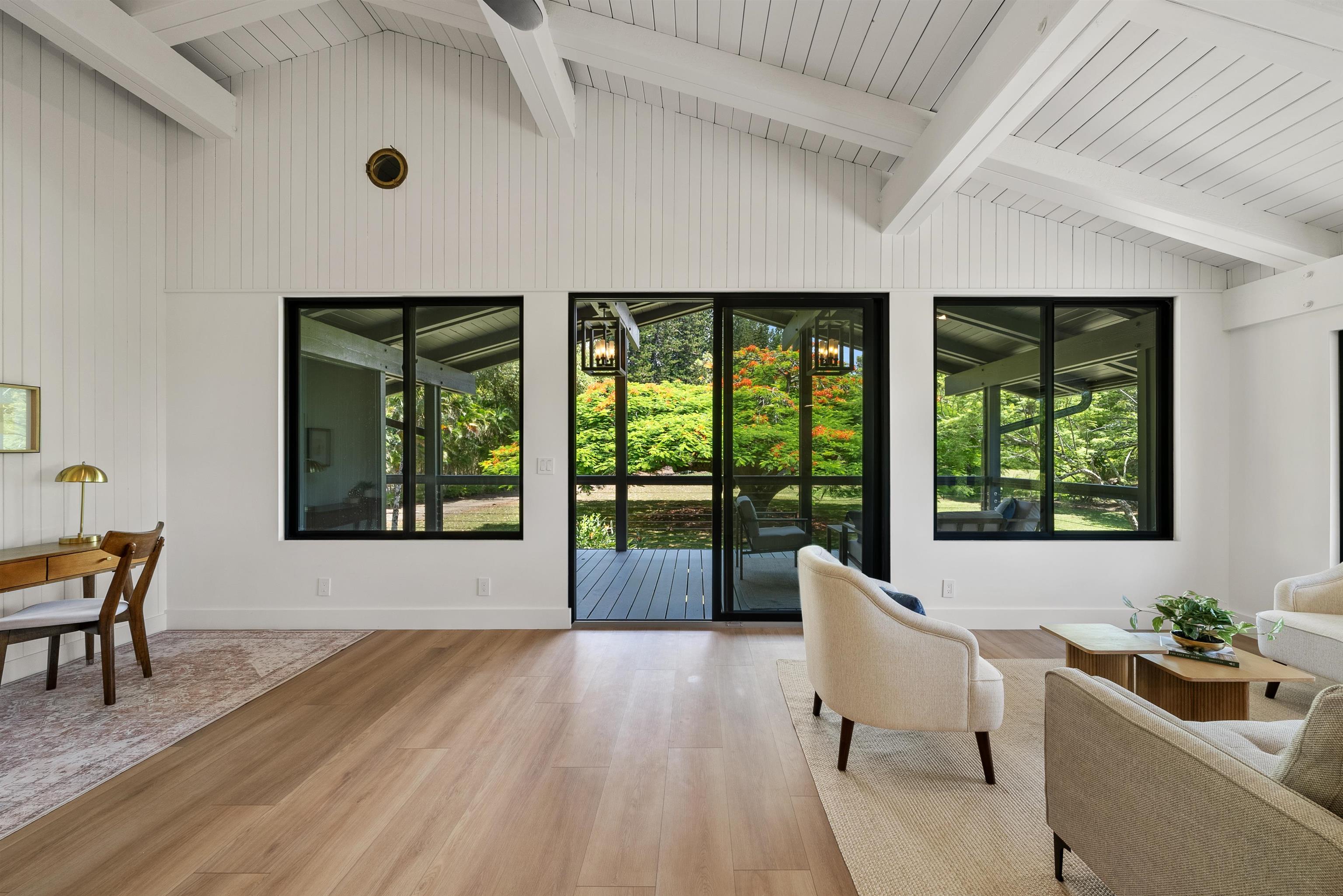 965 Hog Back Road Haiku, HI 96708 - Photo 9 of 35 a living room with furniture and a large window