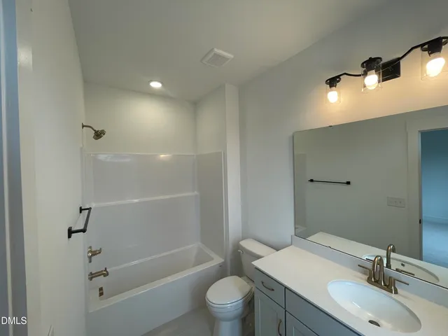 a view of a livingroom with a furniture wooden floor and window