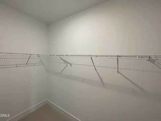 a view of a room with racks on the wall