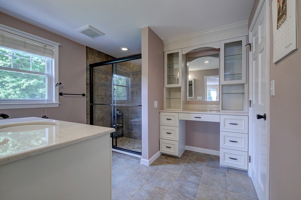 32 Bayberry Road Groton, MA 01450 - Photo 14 of 30 a spacious bathroom with a granite countertop sink mirror and bathtub