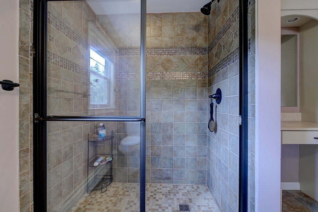32 Bayberry Road Groton, MA 01450 - Photo 15 of 30 a bathroom with a glass shower door