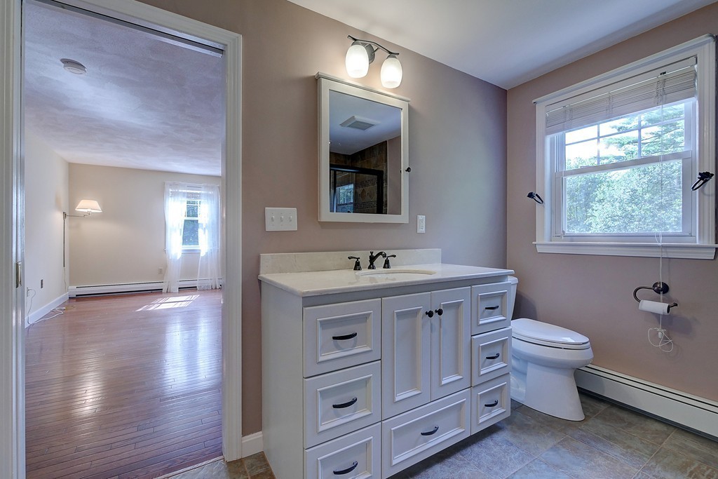 32 Bayberry Road Groton, MA 01450 - Photo 16 of 30 a bathroom with a toilet sink and mirror