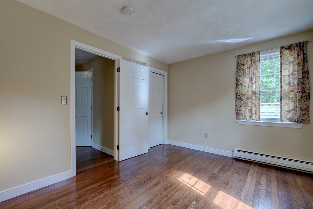 32 Bayberry Road Groton, MA 01450 - Photo 17 of 30 an empty room with wooden floor and windows