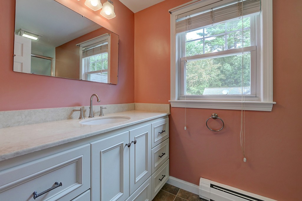 32 Bayberry Road Groton, MA 01450 - Photo 19 of 30 a bathroom with a sink a vanity and a window