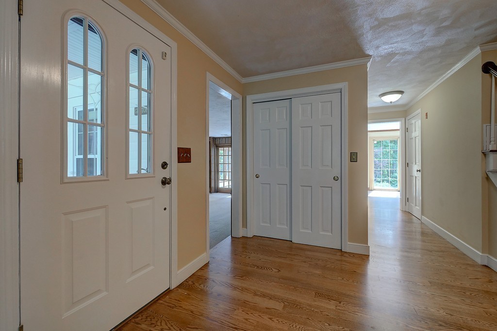 32 Bayberry Road Groton, MA 01450 - Photo 2 of 30 a view of a hallway with wooden floor