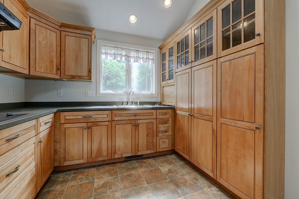 32 Bayberry Road Groton, MA 01450 - Photo 23 of 30 a kitchen with stainless steel appliances granite countertop a refrigerator and a sink