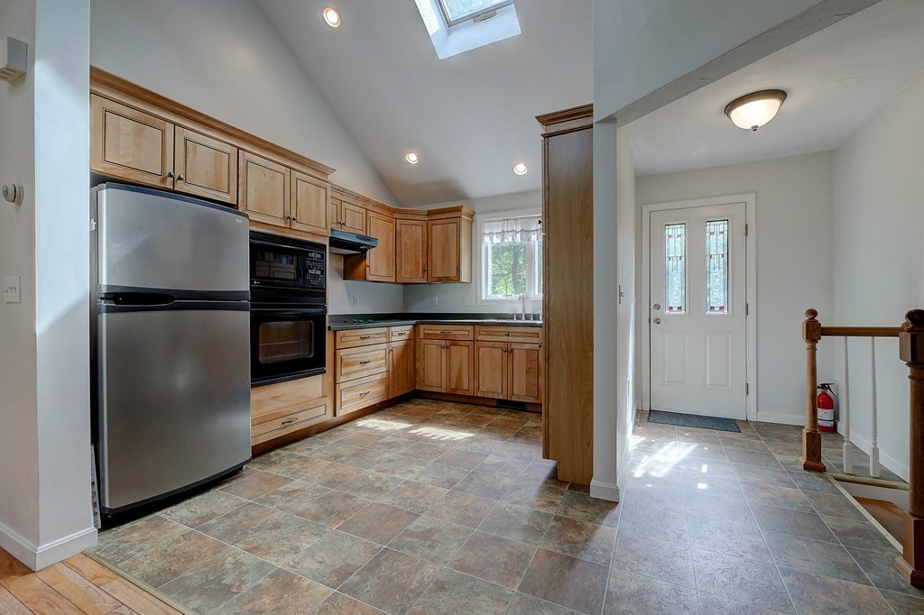 32 Bayberry Road Groton, MA 01450 - Photo 24 of 30 a kitchen with a refrigerator and a sink
