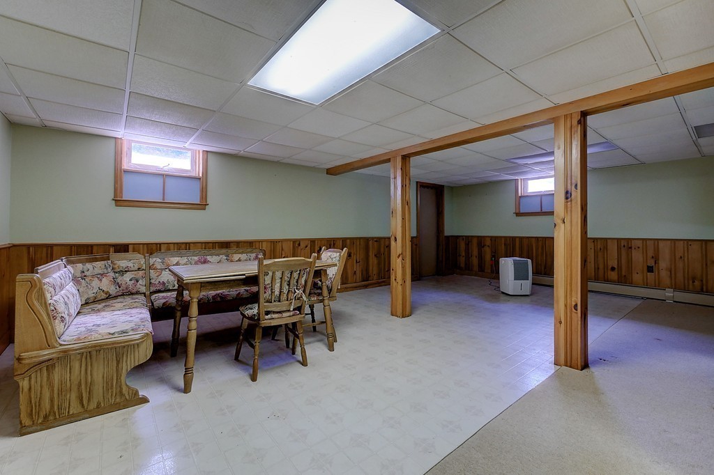 32 Bayberry Road Groton, MA 01450 - Photo 28 of 30 a living room with furniture and a fireplace