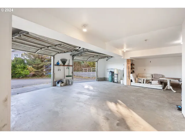 a view of a livingroom with furniture and a garage