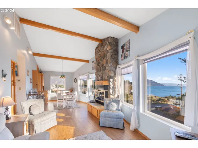 a living room filled with furniture and a large window