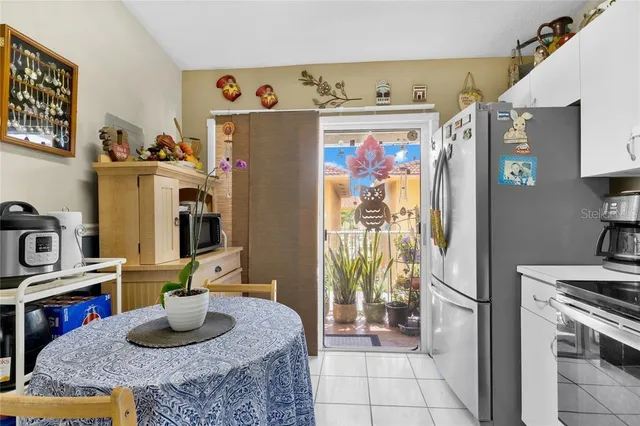 a kitchen with granite countertop a refrigerator and a stove