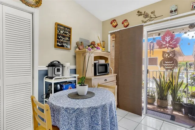 a kitchen with a refrigerator and a stove