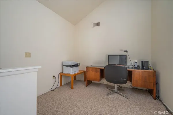 a view of a workspace with furniture