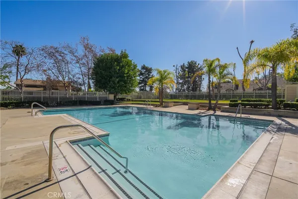 a view of swimming pool with chairs