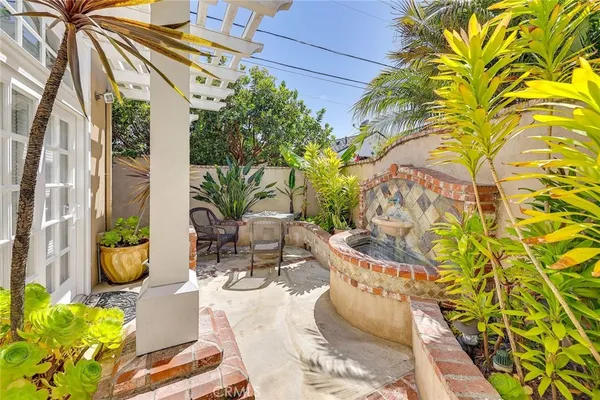 a close view of a sink and a cabinet with wooden floor