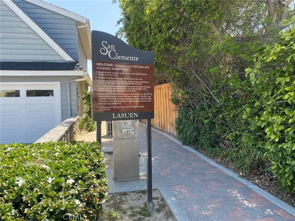 a view of a backyard with sitting area