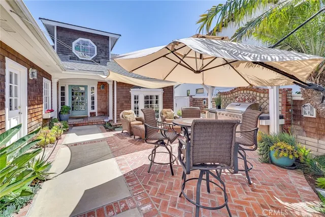 a patio with table and chairs