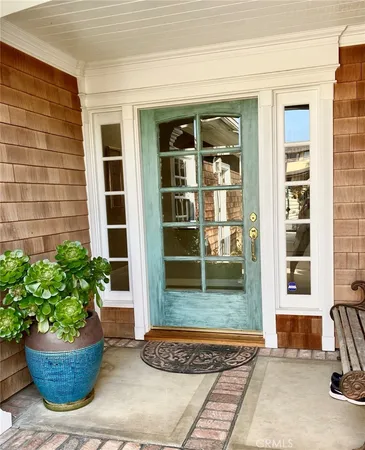a view of an entryway with a floor to ceiling window