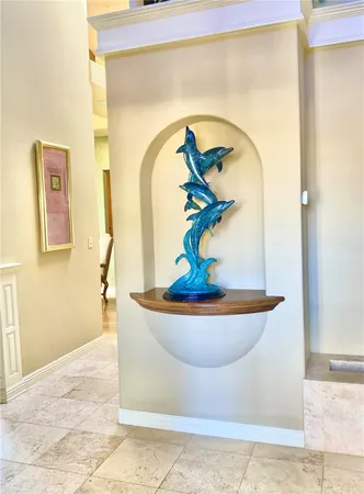 a room with pool table and windows