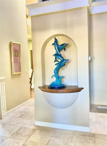 a room with pool table and windows