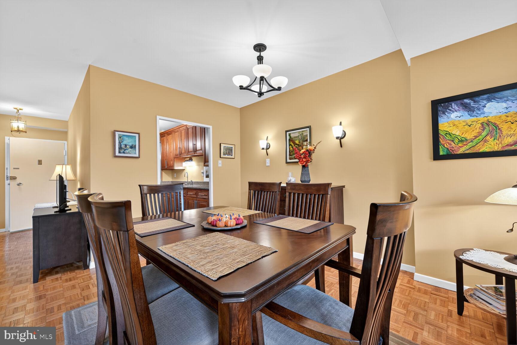 3900 Watson Place Northwest, Unit B1G Washington, DC 20016 - Photo 5 of 16 a view of a dining room with furniture and wooden floor