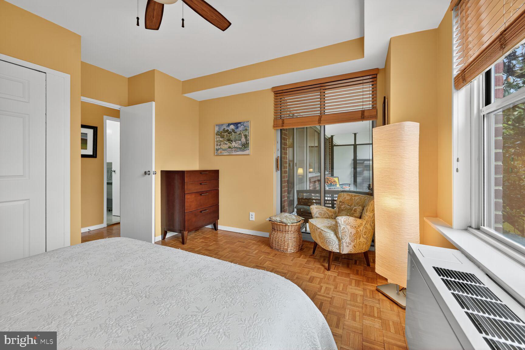 3900 Watson Place Northwest, Unit B1G Washington, DC 20016 - Photo 10 of 16 a bedroom with furniture and large windows