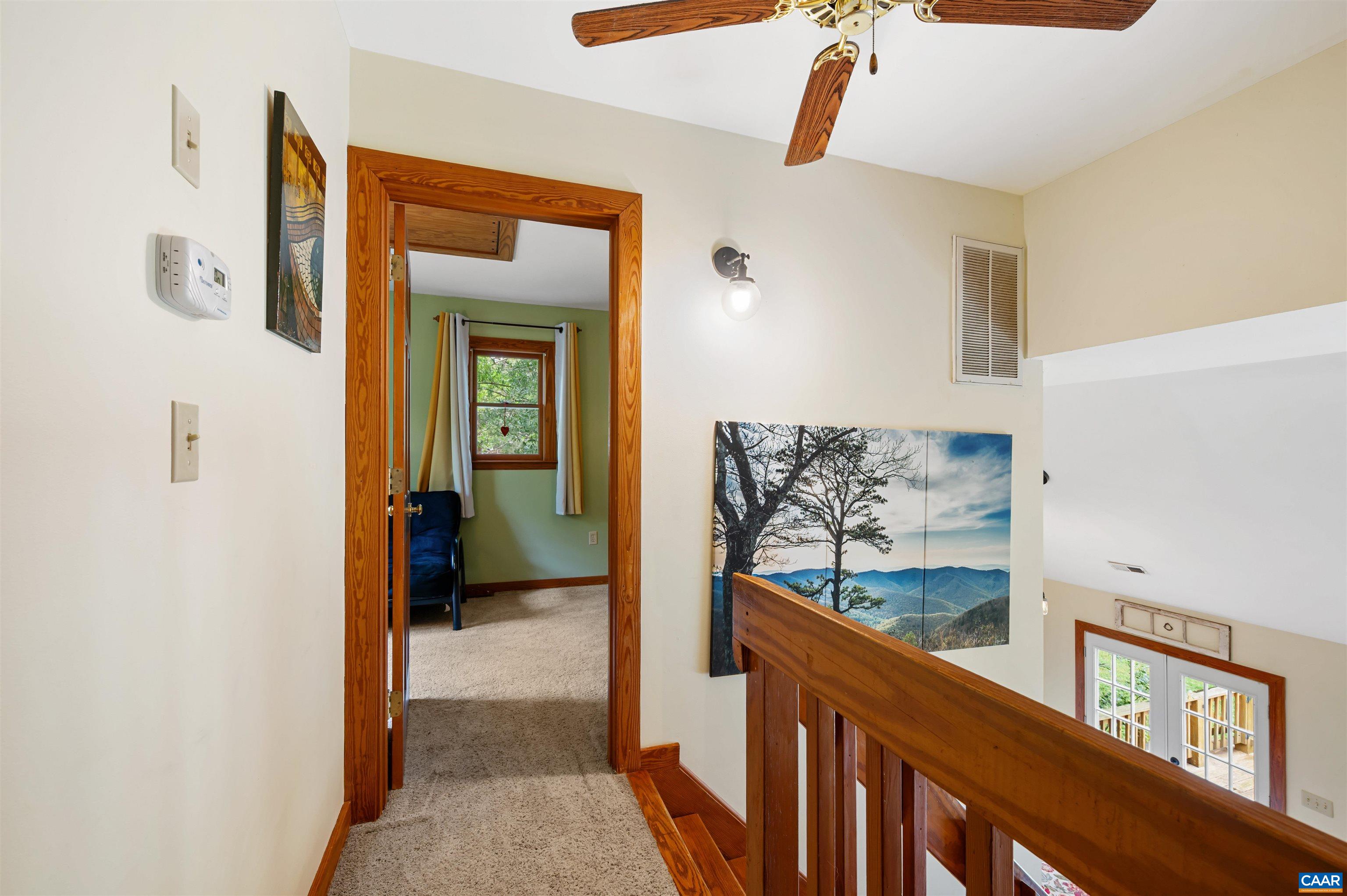 189 Edgehill Way Faber, VA 22938 - Photo 21 of 44 a view of a hallway and a livingroom with wooden floor