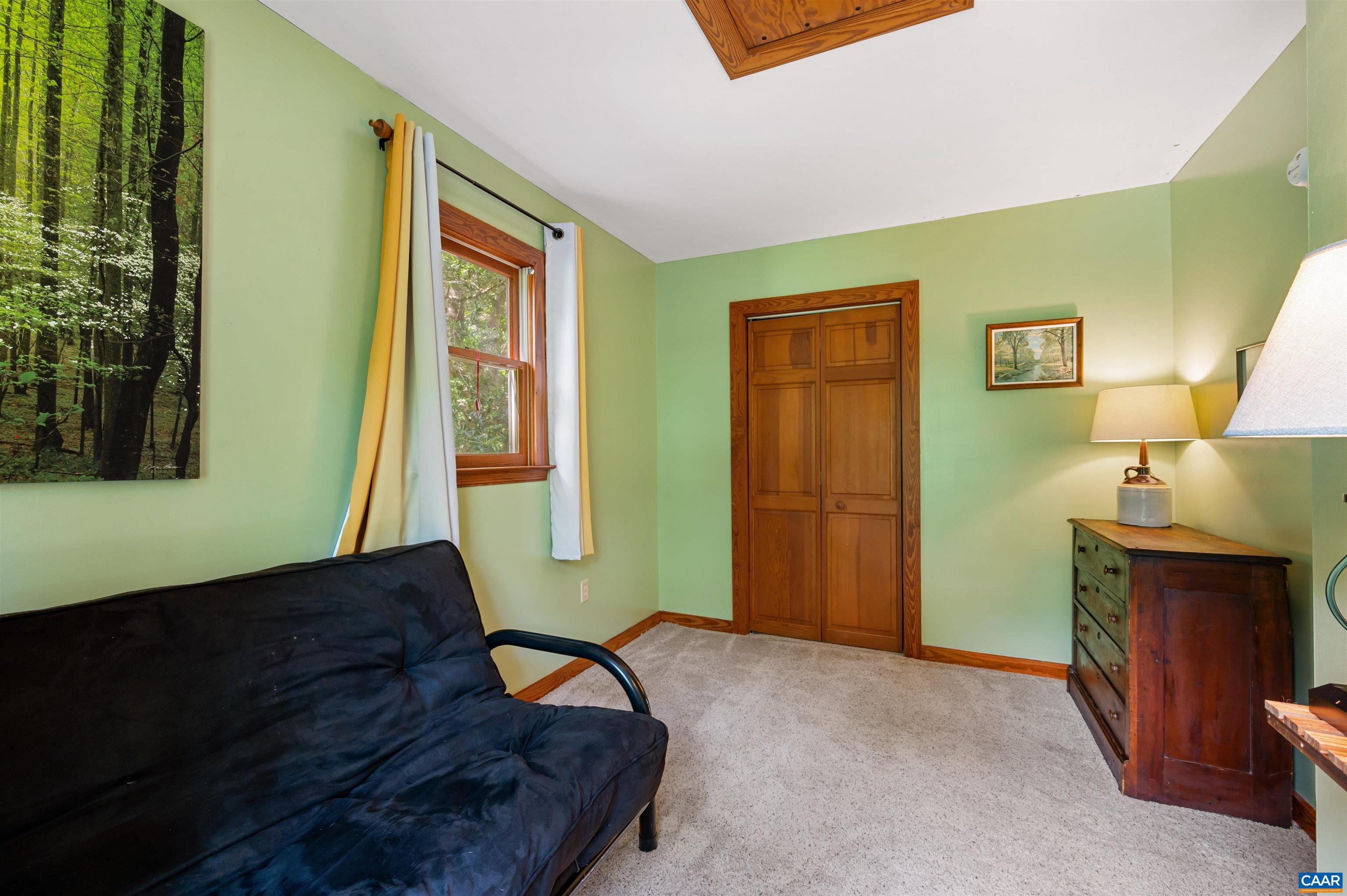 189 Edgehill Way Faber, VA 22938 - Photo 23 of 44 a living room with furniture and a window
