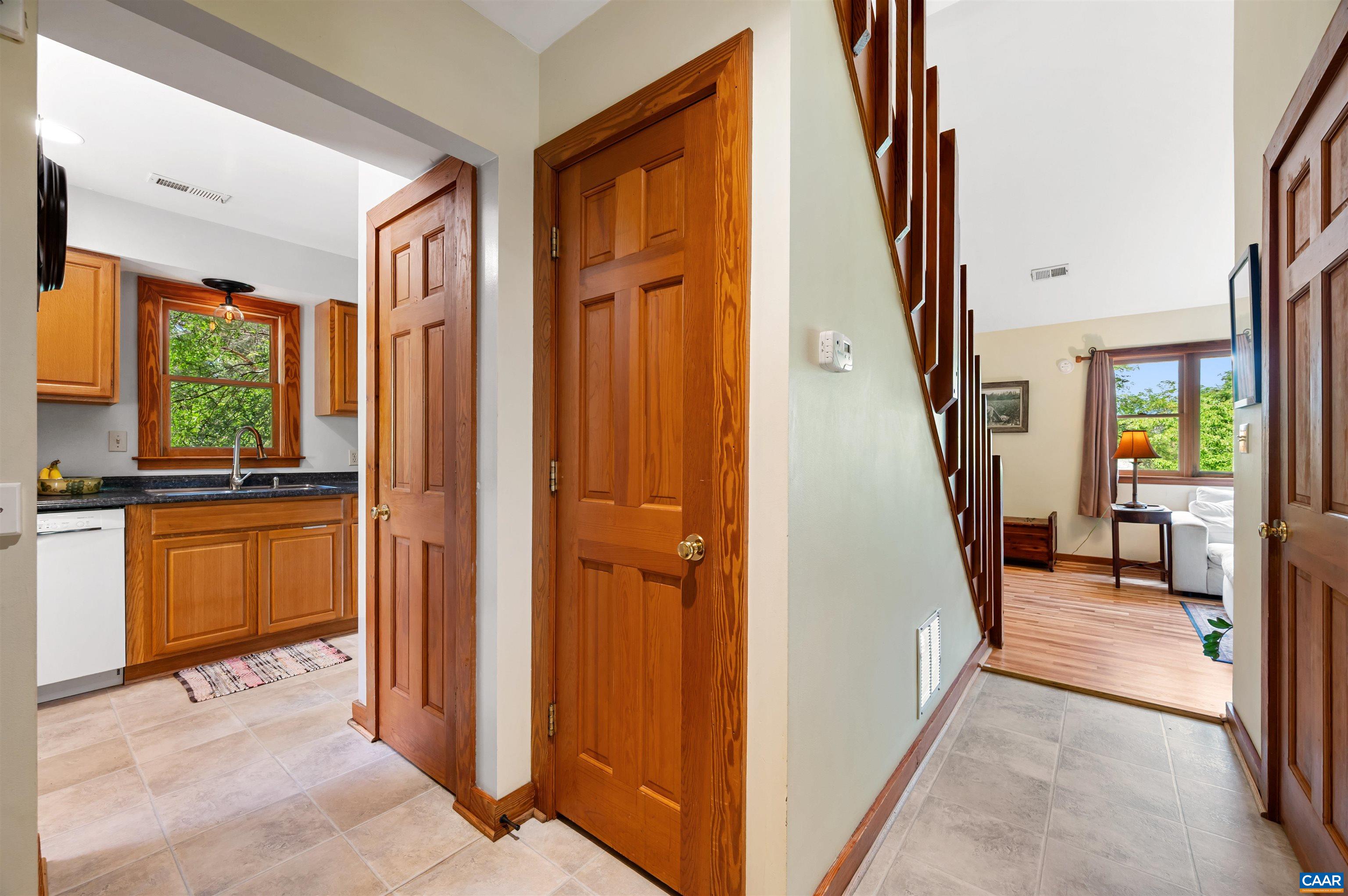 189 Edgehill Way Faber, VA 22938 - Photo 3 of 44 a view of a hallway with wooden floor and a living room