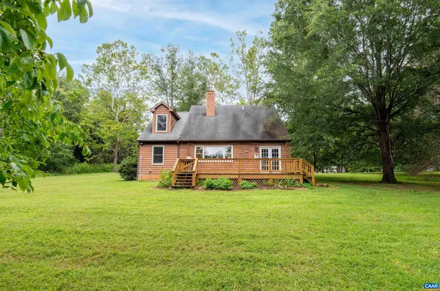 a view of a house with a big yard