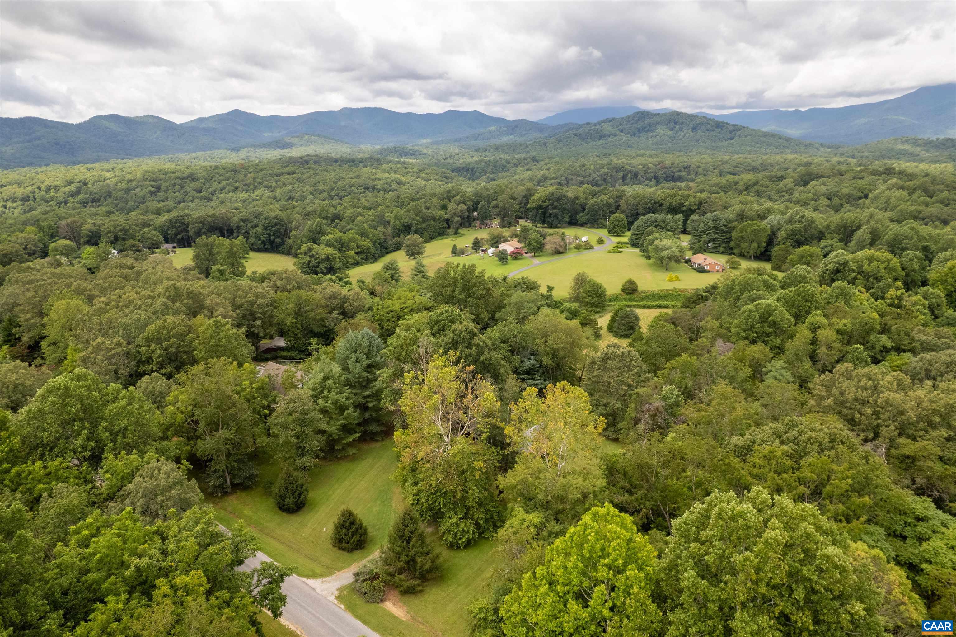 189 Edgehill Way Faber, VA 22938 - Photo 41 of 44 an aerial view of a houses with a lush green hillside