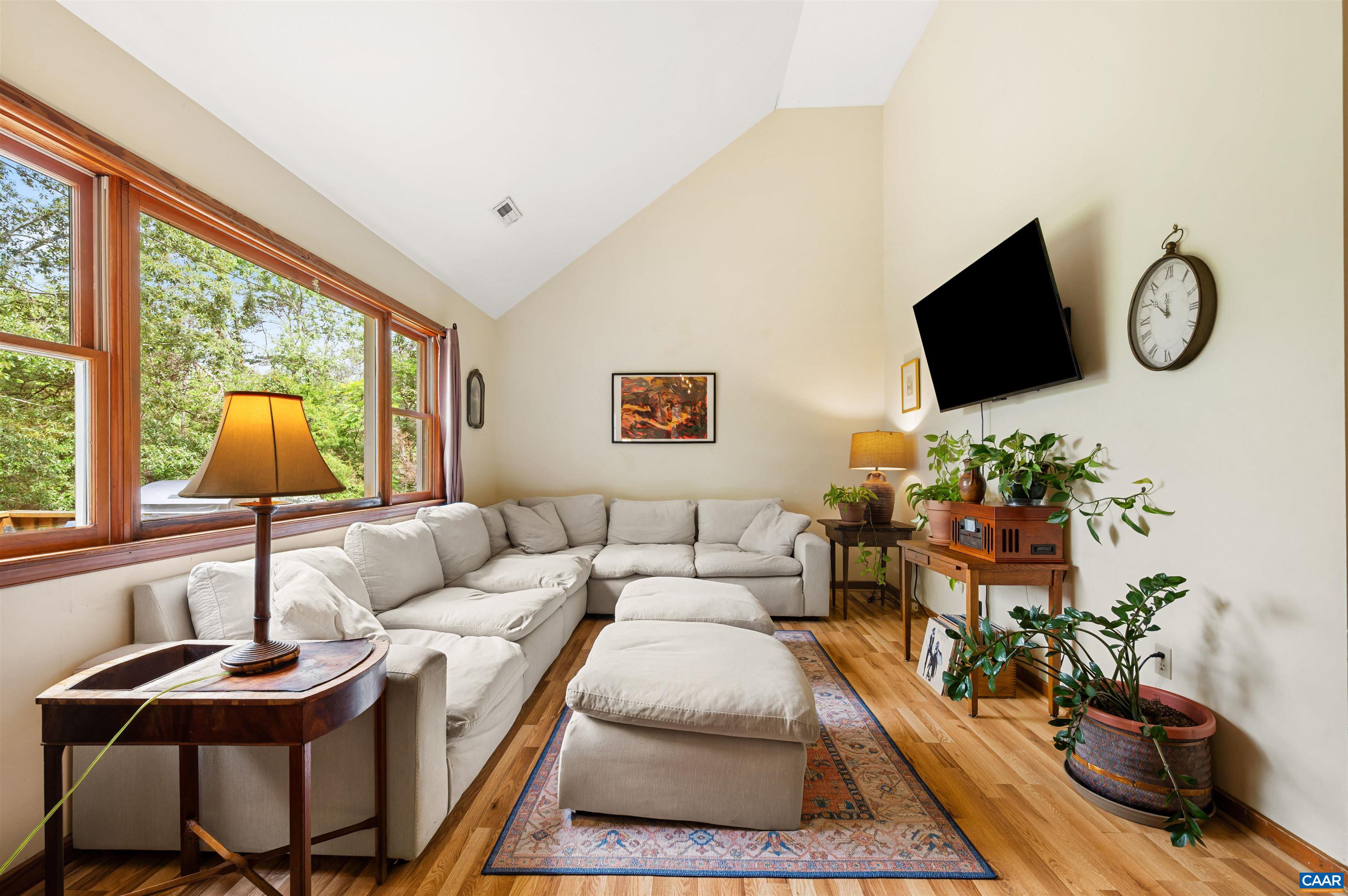 189 Edgehill Way Faber, VA 22938 - Photo 5 of 44 a living room with furniture a flat screen tv and a large window