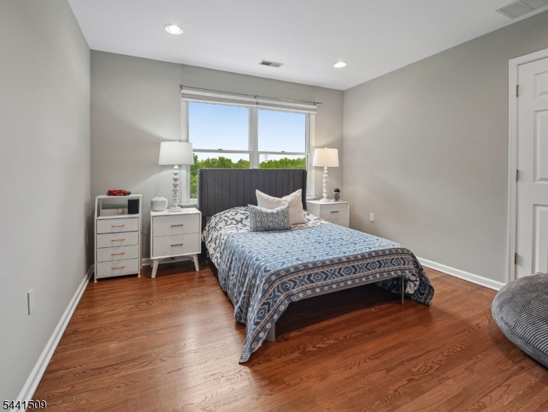 610 River Road Chatham, NJ 07928 - Photo 22 of 42 a bedroom with a bed and a window