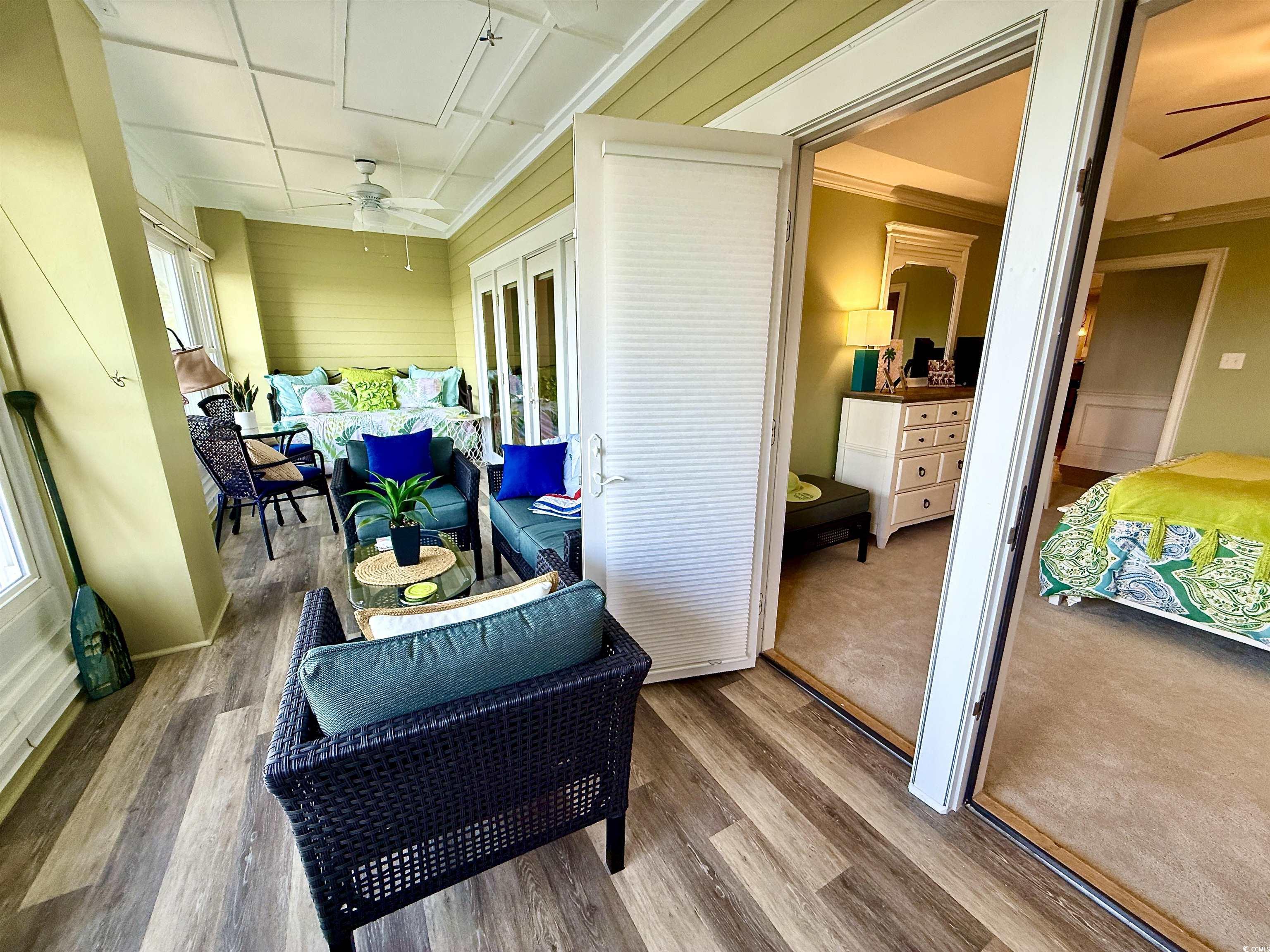 1330 Villa Marbella Court, Unit 303 Myrtle Beach, SC 29572 - Photo 11 of 40 Sunroom / solarium featuring a ceiling fan, outdoor lounge area, and french doors
