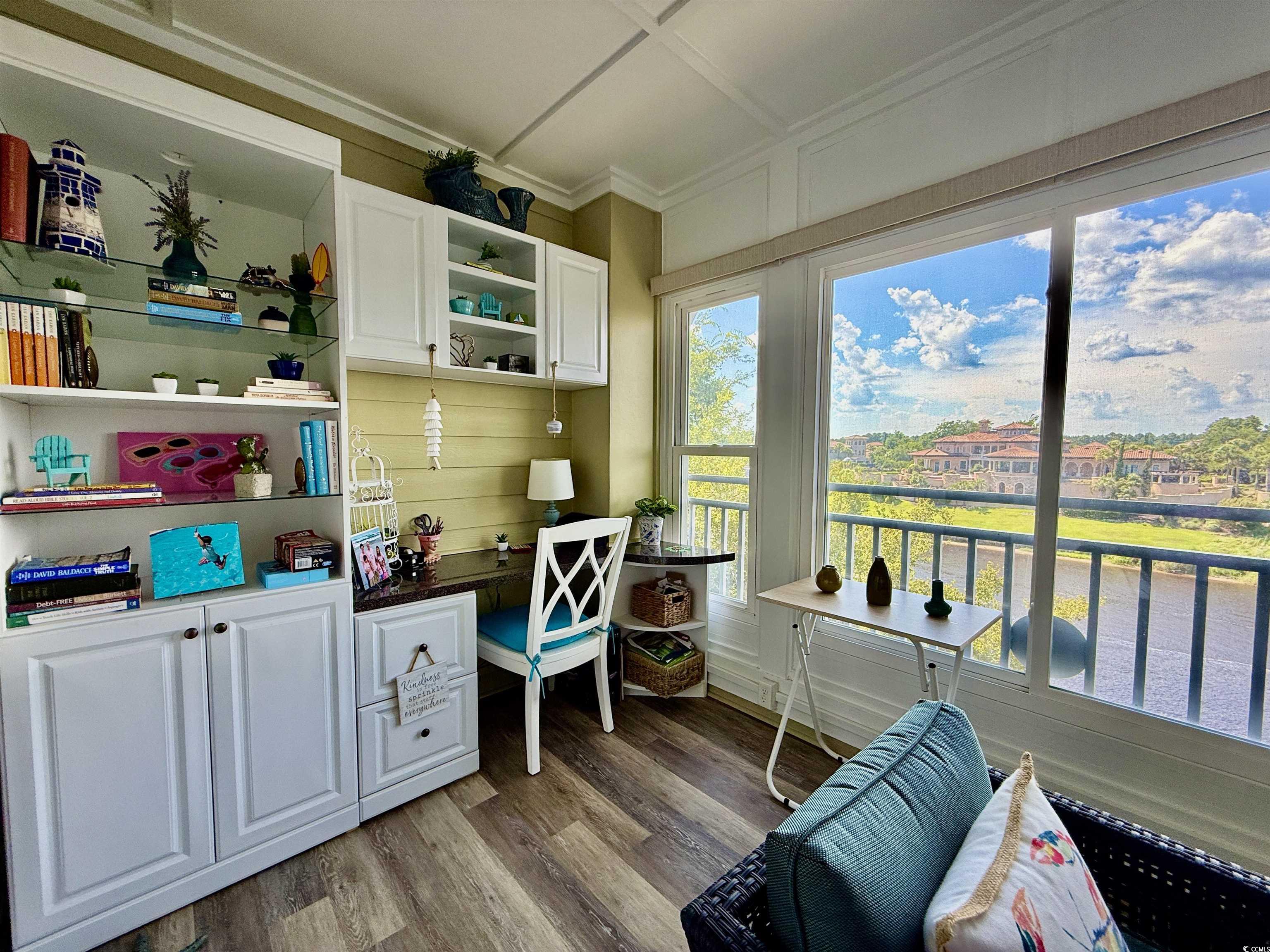 1330 Villa Marbella Court, Unit 303 Myrtle Beach, SC 29572 - Photo 12 of 40 Home office featuring light wood finished floors, a water view, and ornamental molding