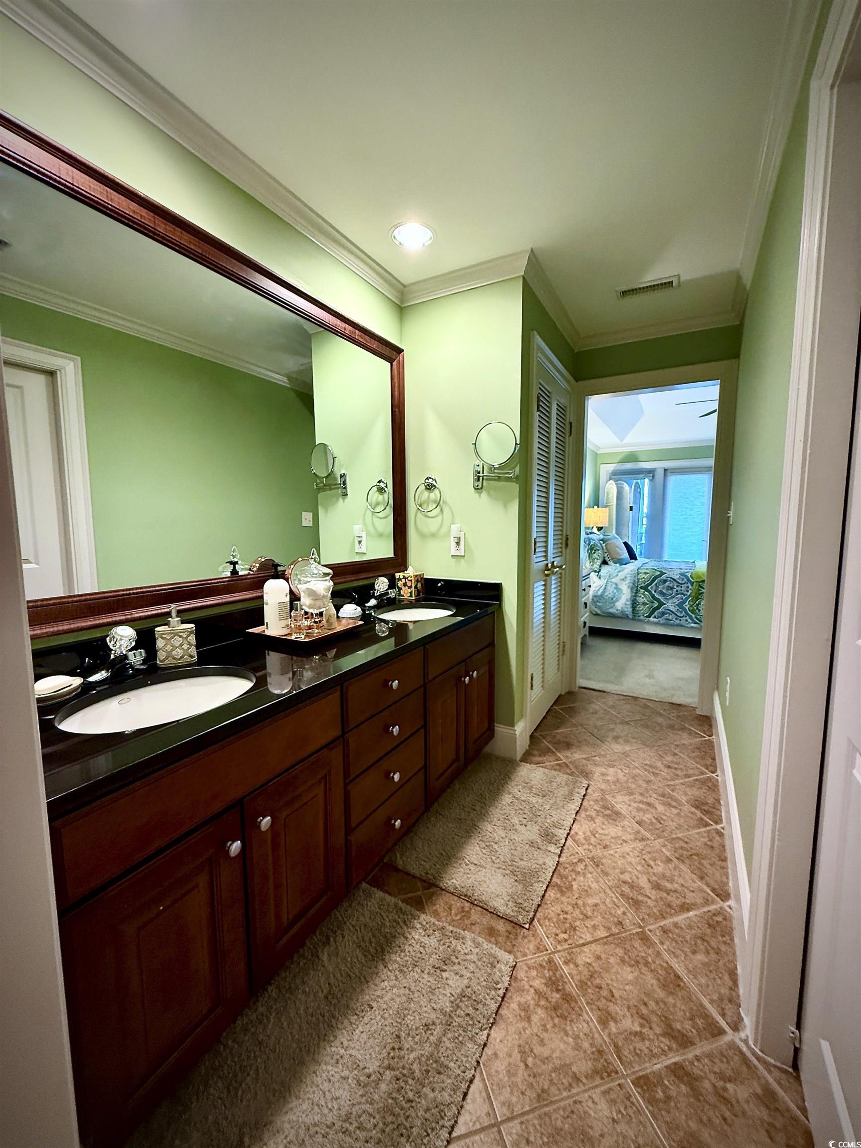 1330 Villa Marbella Court, Unit 303 Myrtle Beach, SC 29572 - Photo 19 of 40 Full bathroom featuring ornamental molding, double vanity, connected bathroom, tile patterned flooring, and recessed lighting