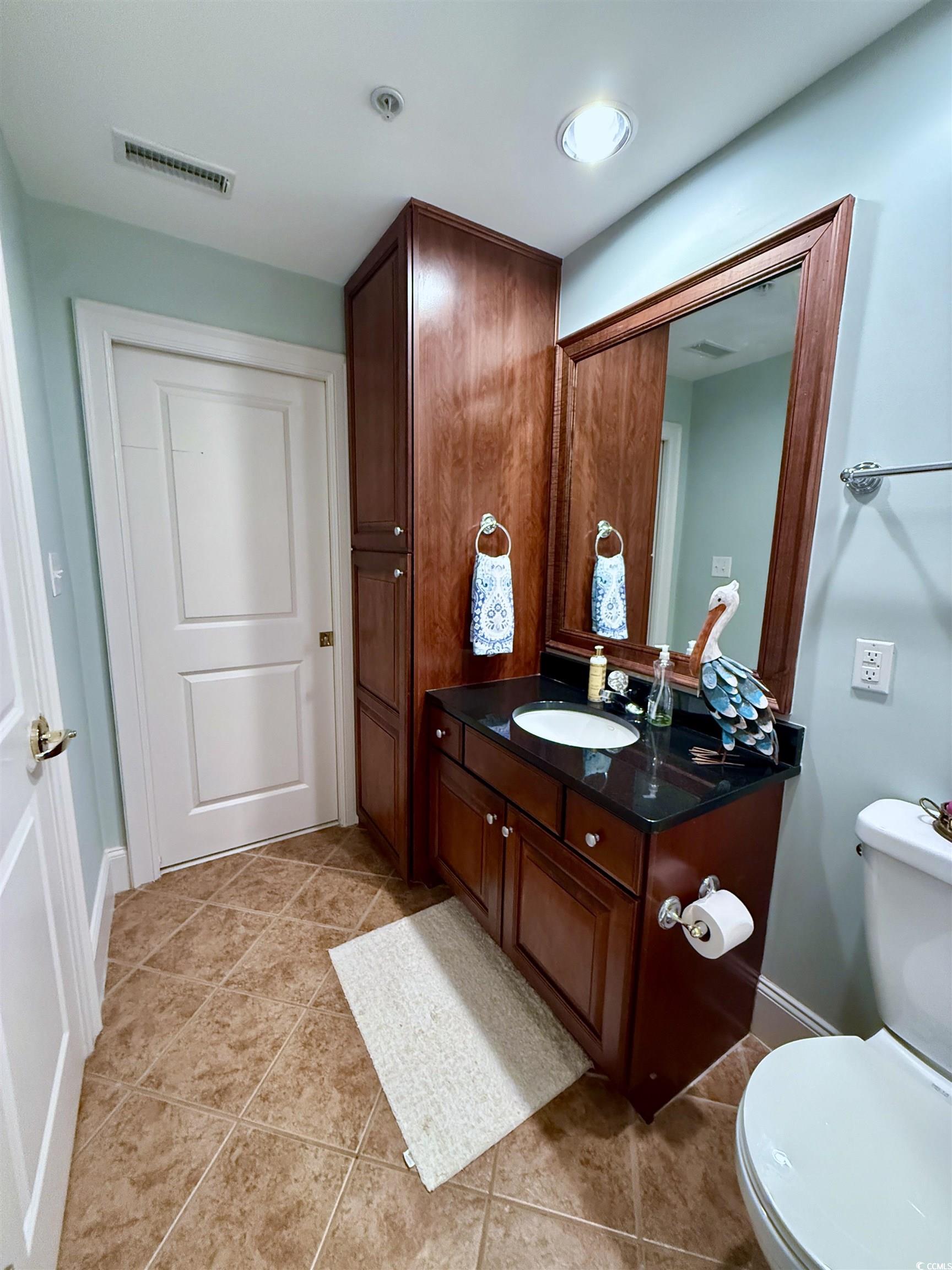 1330 Villa Marbella Court, Unit 303 Myrtle Beach, SC 29572 - Photo 24 of 40 Bathroom with vanity and tile patterned floors