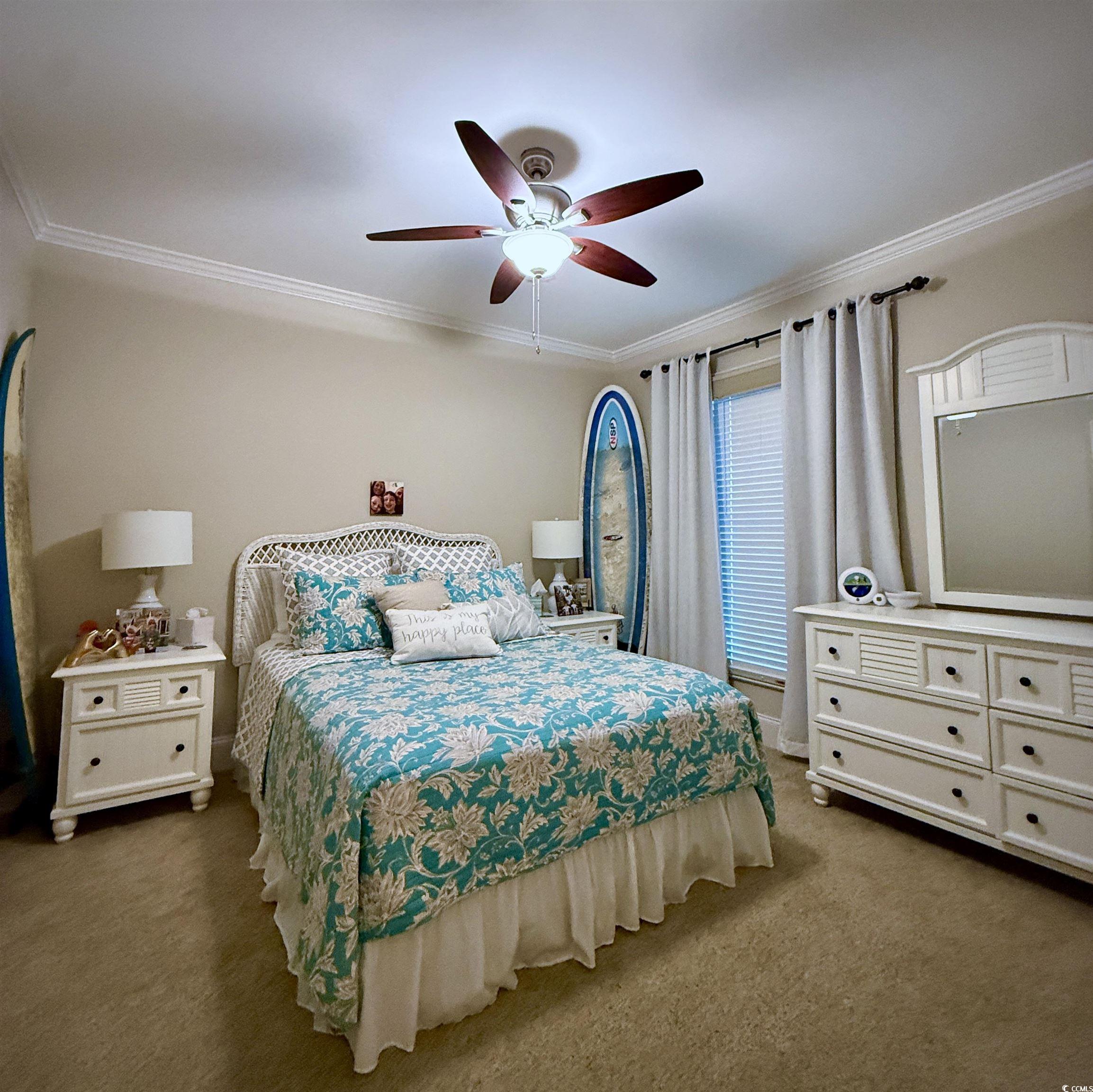 1330 Villa Marbella Court, Unit 303 Myrtle Beach, SC 29572 - Photo 25 of 40 Bedroom featuring crown molding, carpet flooring, and ceiling fan