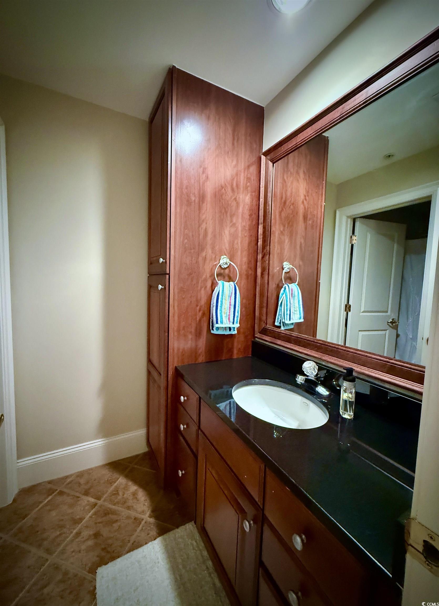 1330 Villa Marbella Court, Unit 303 Myrtle Beach, SC 29572 - Photo 26 of 40 Bathroom with vanity and tile patterned flooring